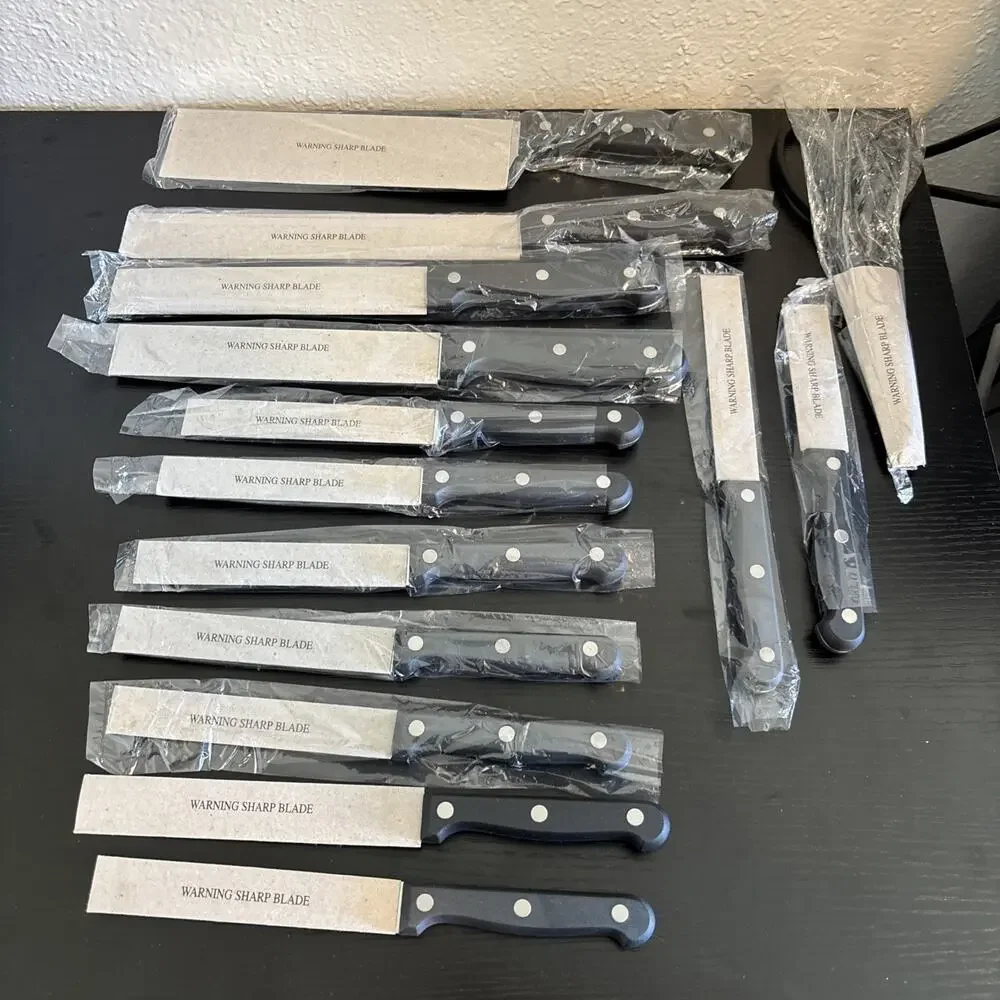 14 Piece serrated stainless steel blades and black handles with triple rivets